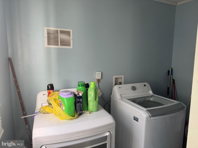 laundry room featuring washing machine and dryer