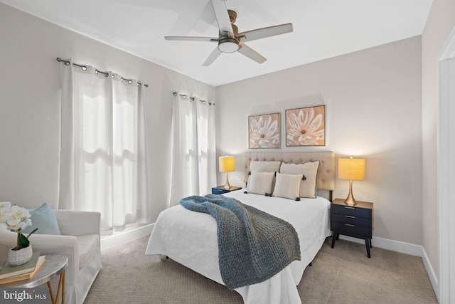 bedroom featuring light carpet and ceiling fan