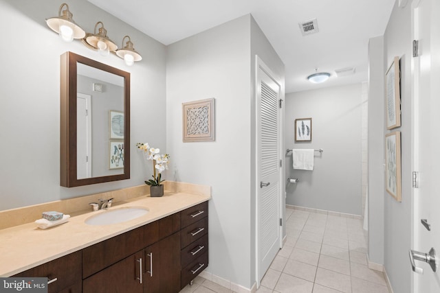 bathroom with vanity and tile patterned flooring