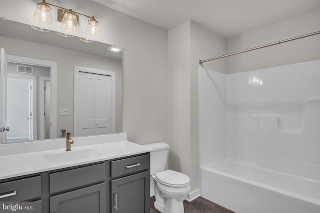 bathroom featuring visible vents, tub / shower combination, toilet, tile patterned floors, and vanity