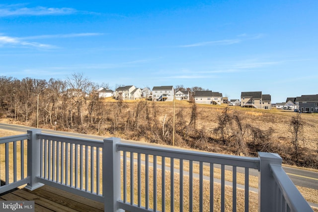 wooden deck with a residential view