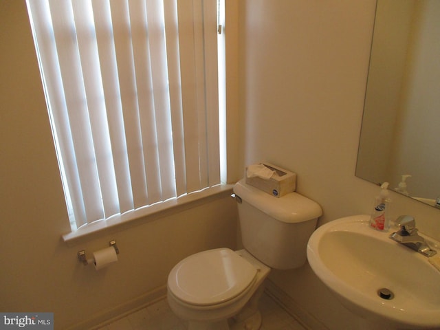 bathroom with sink and toilet