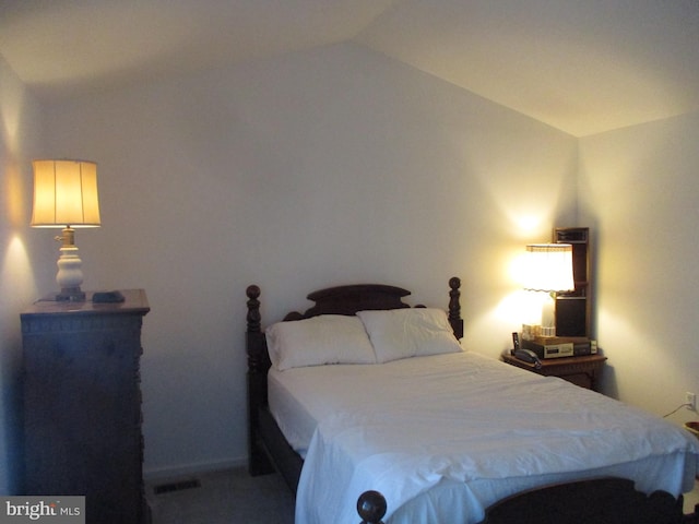 bedroom with vaulted ceiling