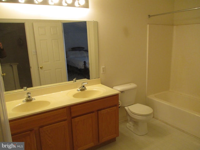 full bathroom with vanity, shower / bathing tub combination, and toilet