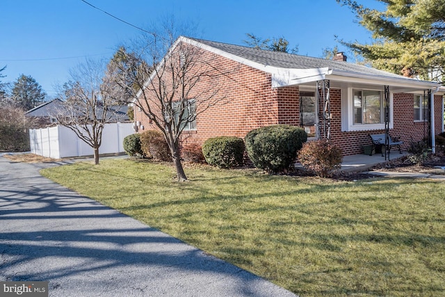 view of property exterior featuring a lawn