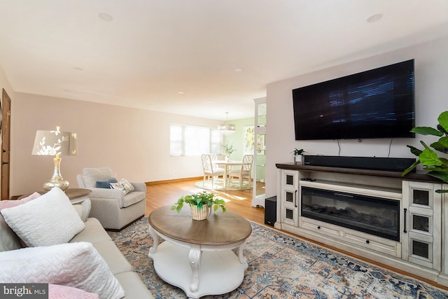 living room with light hardwood / wood-style flooring