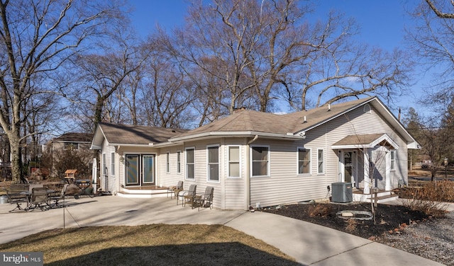 exterior space with central AC and a patio