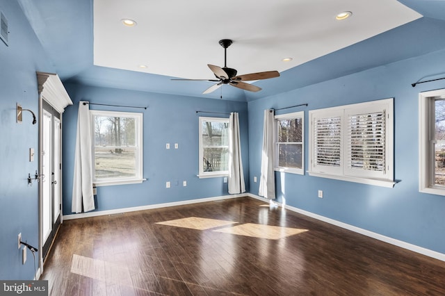 unfurnished room with dark wood-type flooring and ceiling fan