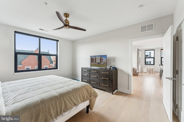 bedroom featuring ceiling fan and light hardwood / wood-style floors