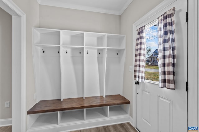 mudroom with crown molding and hardwood / wood-style floors