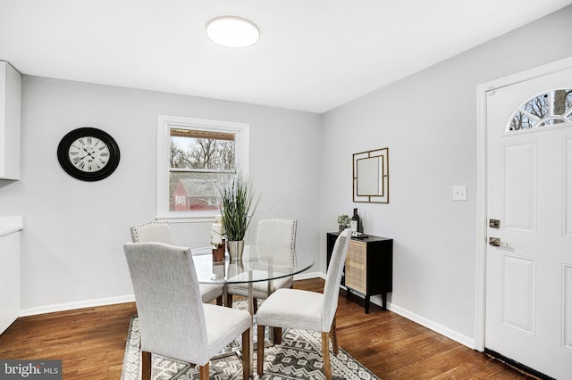 dining space featuring dark wood-type flooring