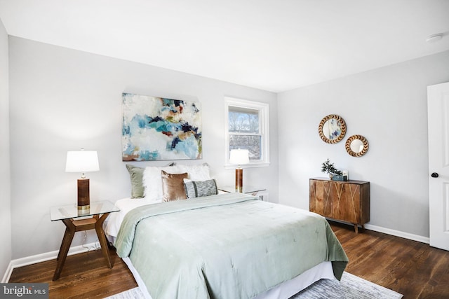 bedroom featuring dark hardwood / wood-style flooring