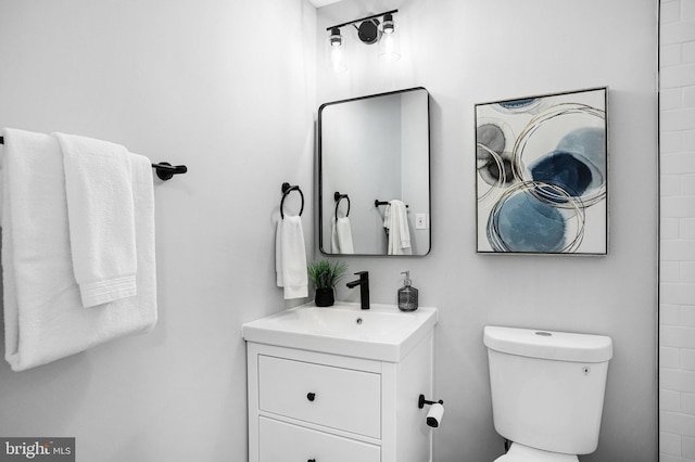 bathroom with vanity and toilet