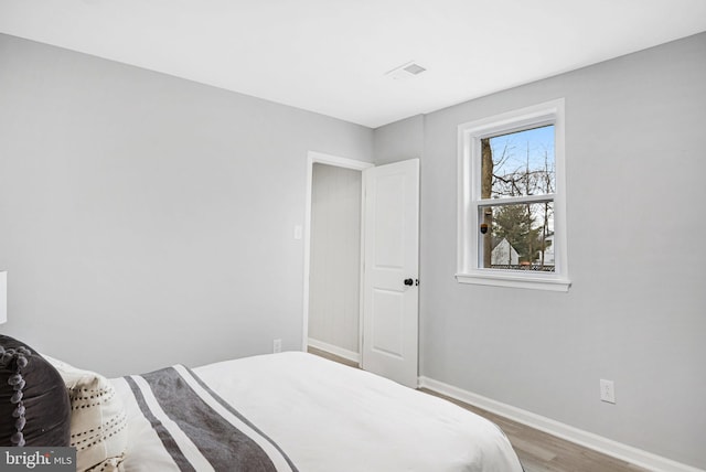 bedroom featuring hardwood / wood-style floors