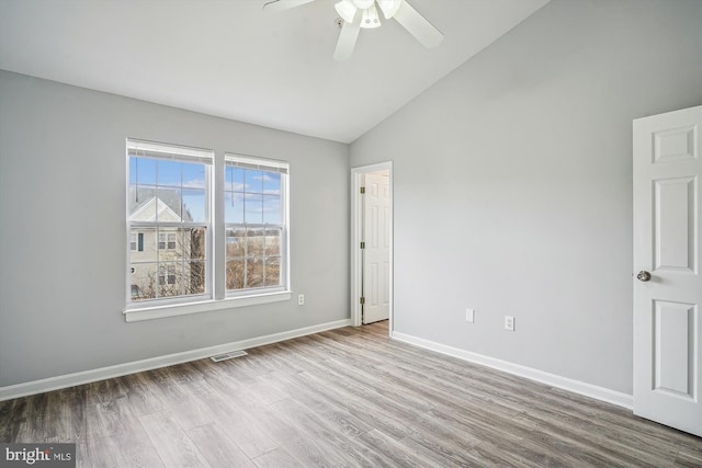 unfurnished room with ceiling fan, high vaulted ceiling, and light hardwood / wood-style flooring