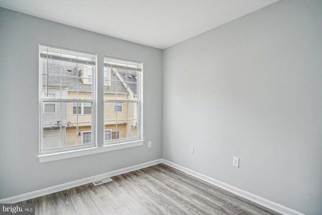 empty room featuring hardwood / wood-style floors