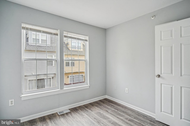 empty room featuring wood-type flooring