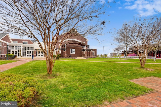 view of home's community featuring a yard