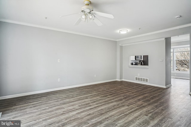 spare room with ceiling fan, ornamental molding, and dark hardwood / wood-style floors