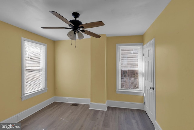 spare room with ceiling fan and light hardwood / wood-style flooring