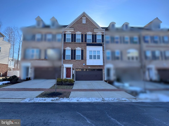 townhome / multi-family property featuring a garage