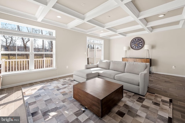 living room featuring beamed ceiling, plenty of natural light, and coffered ceiling