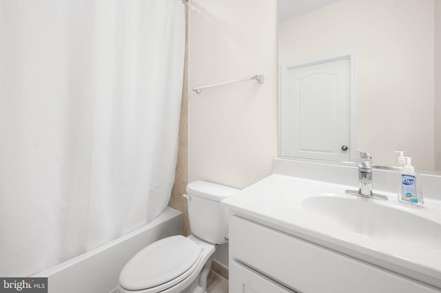 full bathroom with vanity, toilet, and shower / tub combo