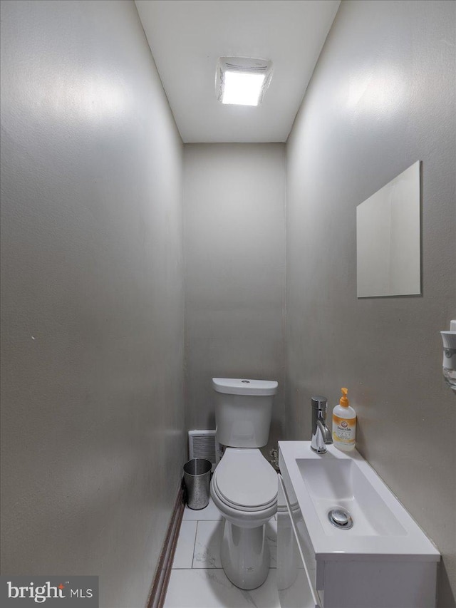 bathroom with toilet and sink