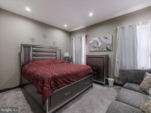 bedroom featuring light carpet