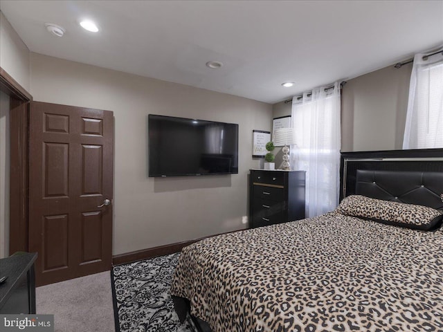 bedroom with light colored carpet