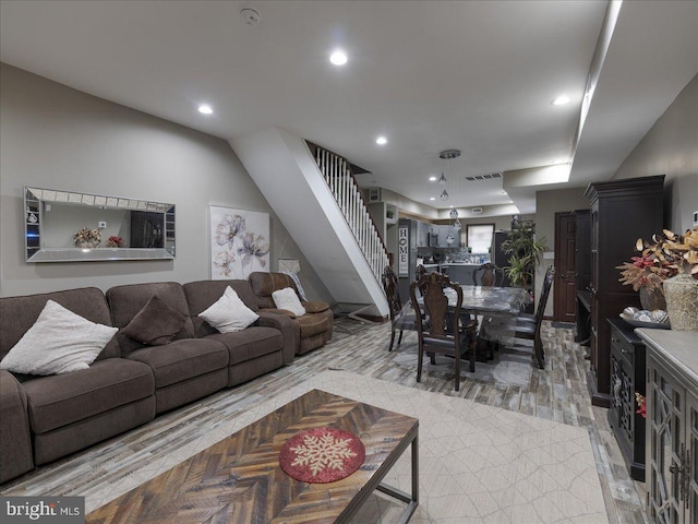 living room with light hardwood / wood-style flooring