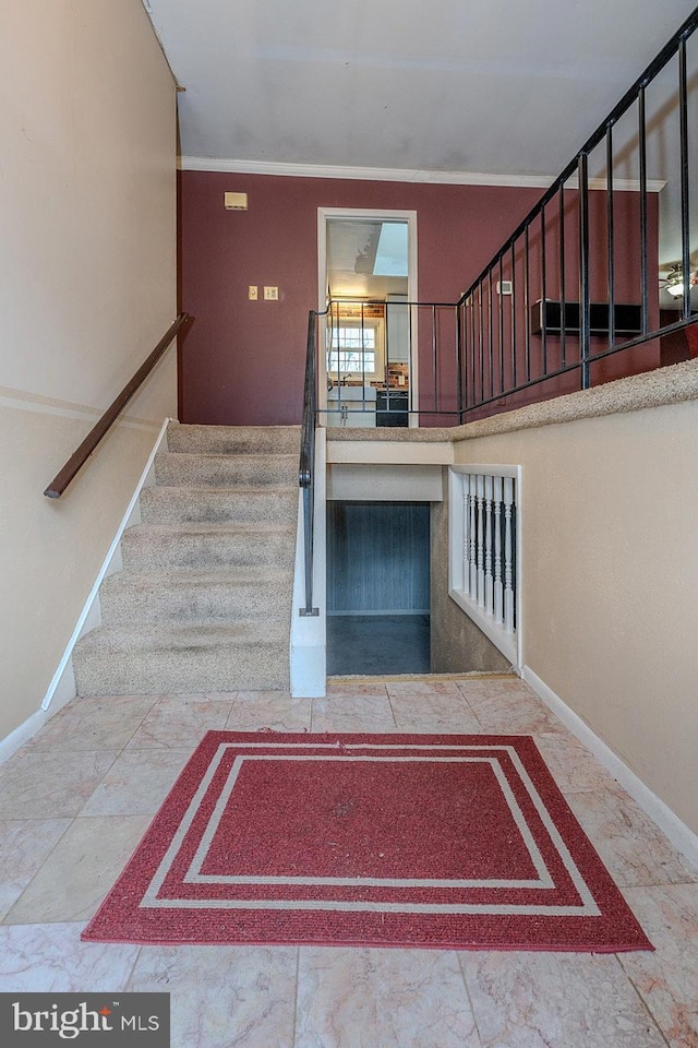 staircase with ornamental molding