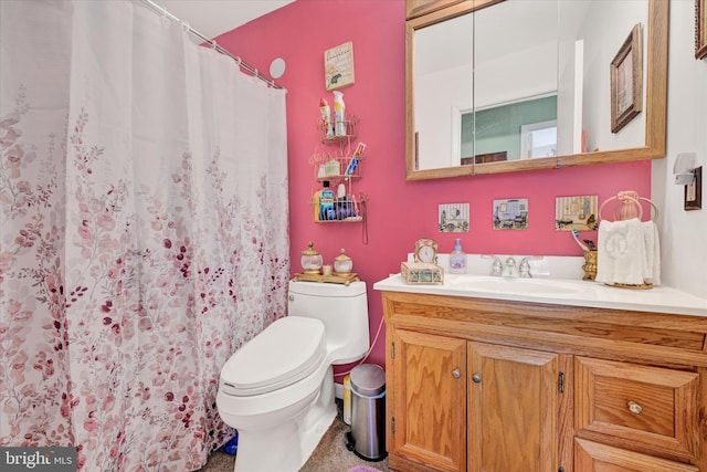 bathroom with vanity and toilet