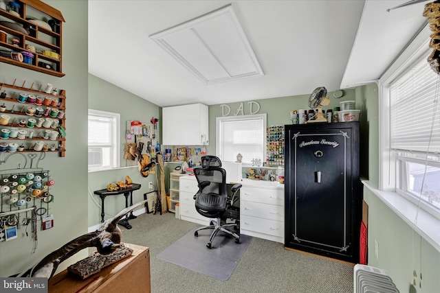 home office with lofted ceiling and carpet flooring