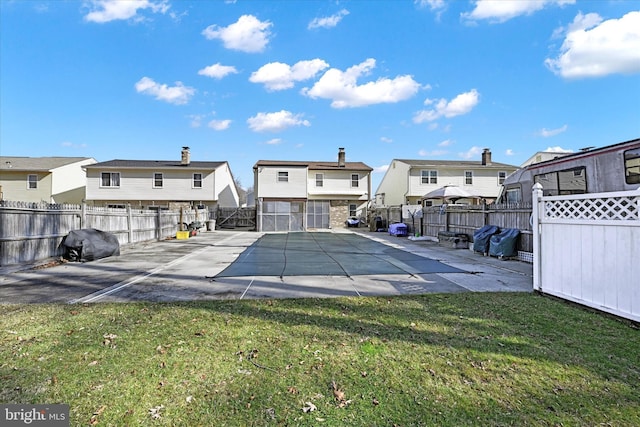 exterior space featuring a lawn and a patio area