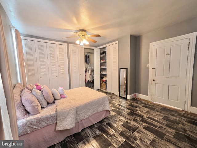 bedroom featuring multiple closets and ceiling fan