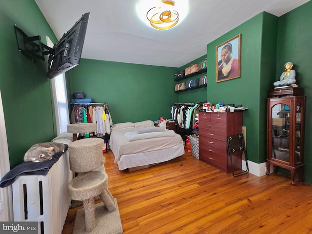 bedroom featuring wood-type flooring