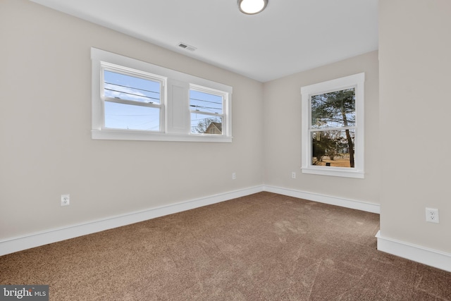 empty room featuring carpet floors