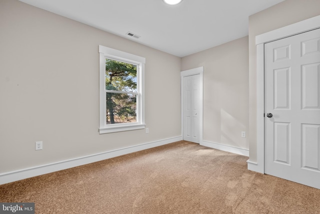 unfurnished bedroom with carpet flooring