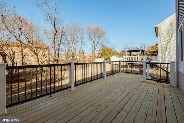 wooden deck with a gazebo