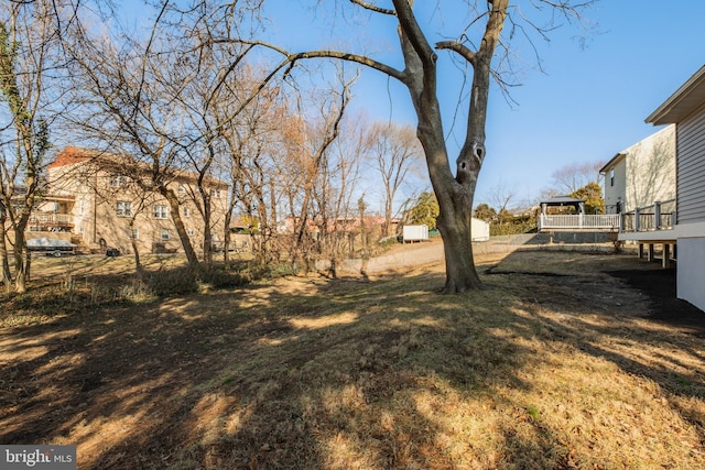 view of yard with a wooden deck