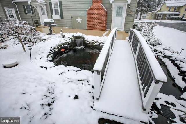 view of yard covered in snow