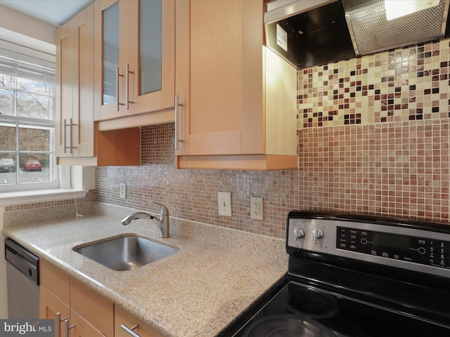 kitchen with sink, backsplash, stainless steel appliances, light stone countertops, and light brown cabinets