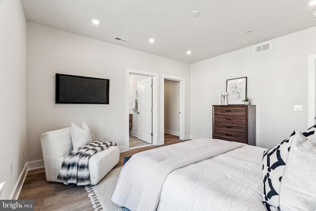 bedroom with hardwood / wood-style flooring