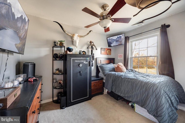 bedroom with ceiling fan and light colored carpet