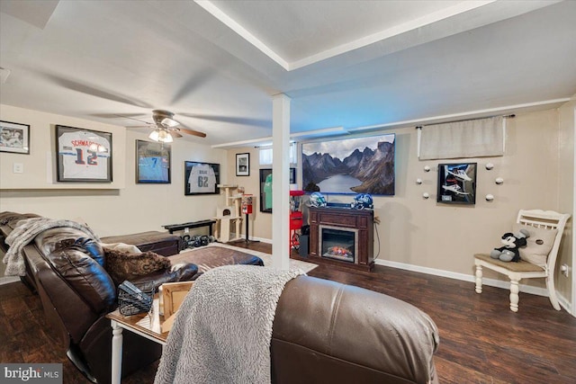 living room with dark wood-type flooring and ceiling fan