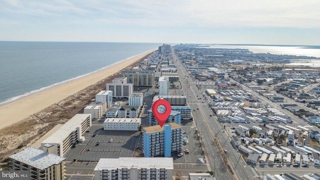 birds eye view of property featuring a view of the beach and a water view