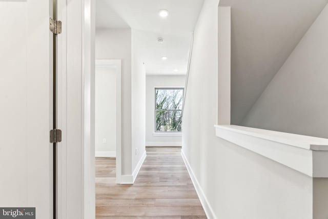 corridor featuring light hardwood / wood-style floors