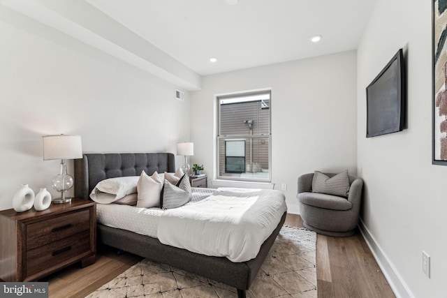 bedroom with light wood-type flooring