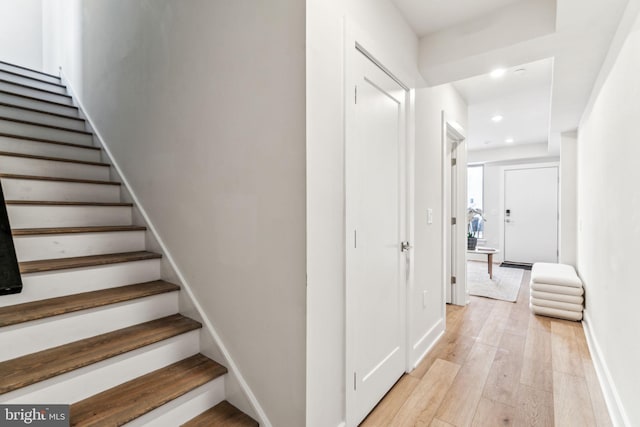 stairway featuring wood-type flooring